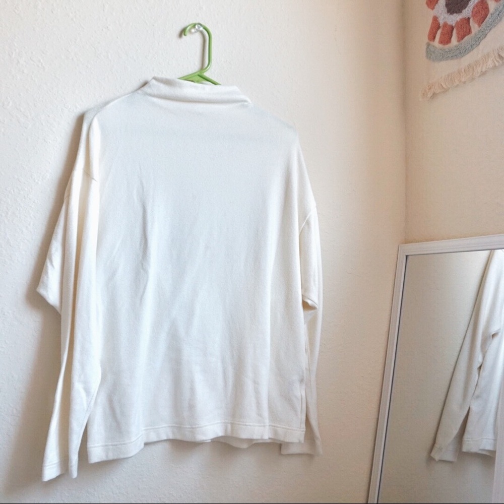 White turtle neck blouse